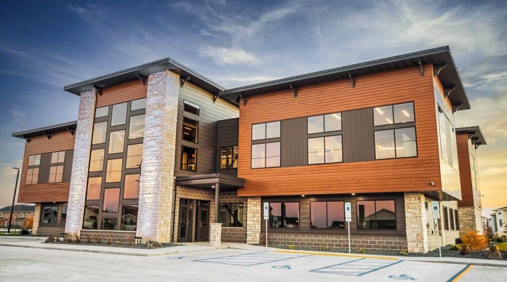 LUX Lap V-Groove 4" in Knotty Redwood Steel Siding Price in Seattle - Best Metal Siding Installation Company